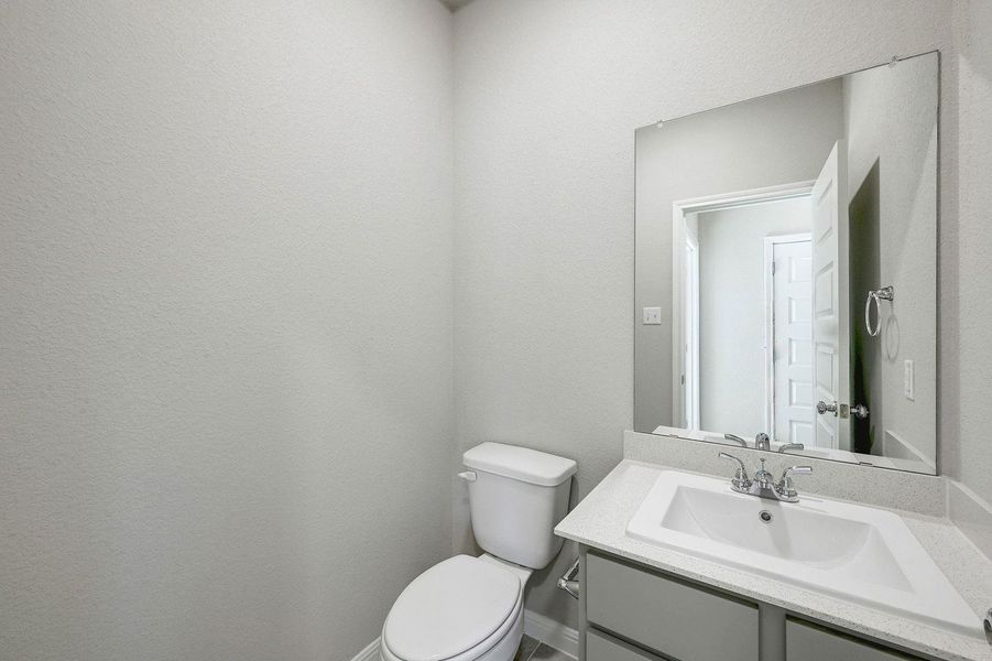 Half Bath in the Willow home plan by Trophy Signature Homes – REPRESENTATIVE PHOTO