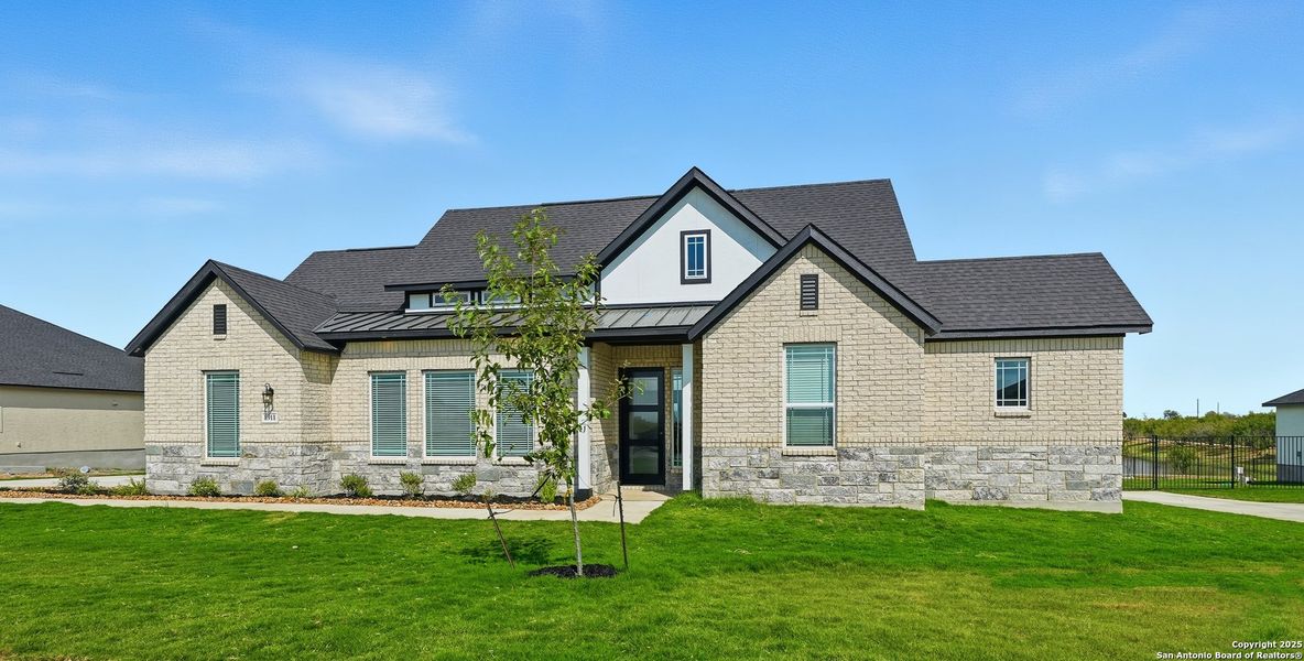 Front exterior of a new home in Sienna Lakes, San Antonio, TX, highlighting curb appeal (Image 26). Front exterior of a new home in Sienna Lakes, San Antonio, TX, highlighting curb appeal (Image 26).
