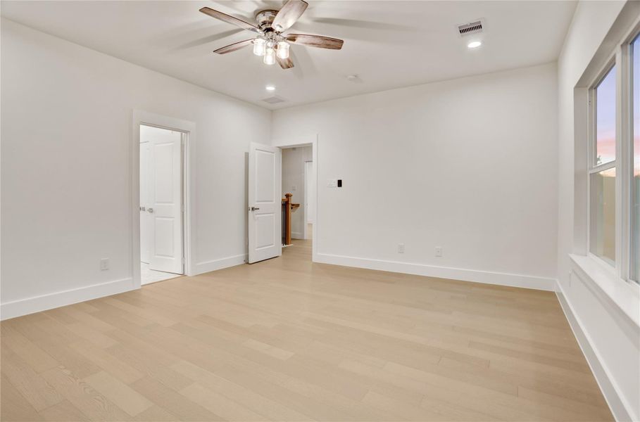 Generous primary bedroom with ensuite access and an open, airy layout.