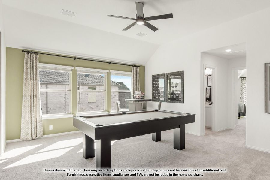 Game room with pool table, vaulted ceiling, ceiling fan, and carpet flooring Game room with pool table, vaulted ceiling, ceiling fan, and carpet flooring