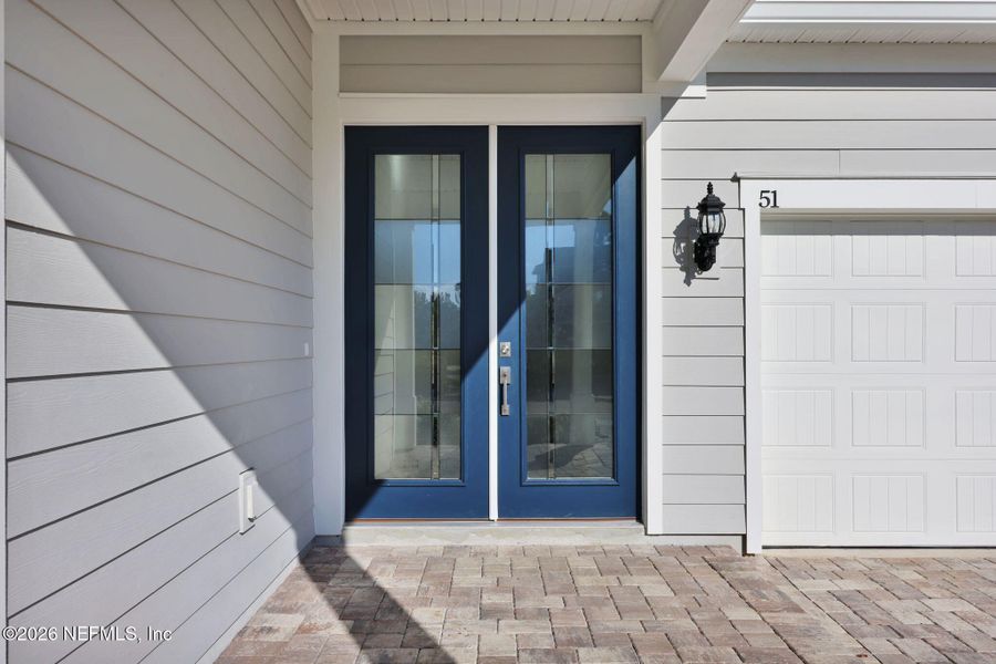 Exterior details and patio area of a home in The Landings at Saint Johns, St. Johns (Image 4).