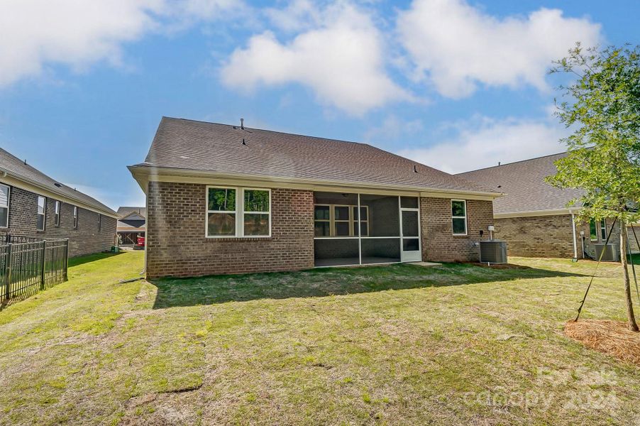 View of Back of House with Screened Porch-Photo similar to Subject Property