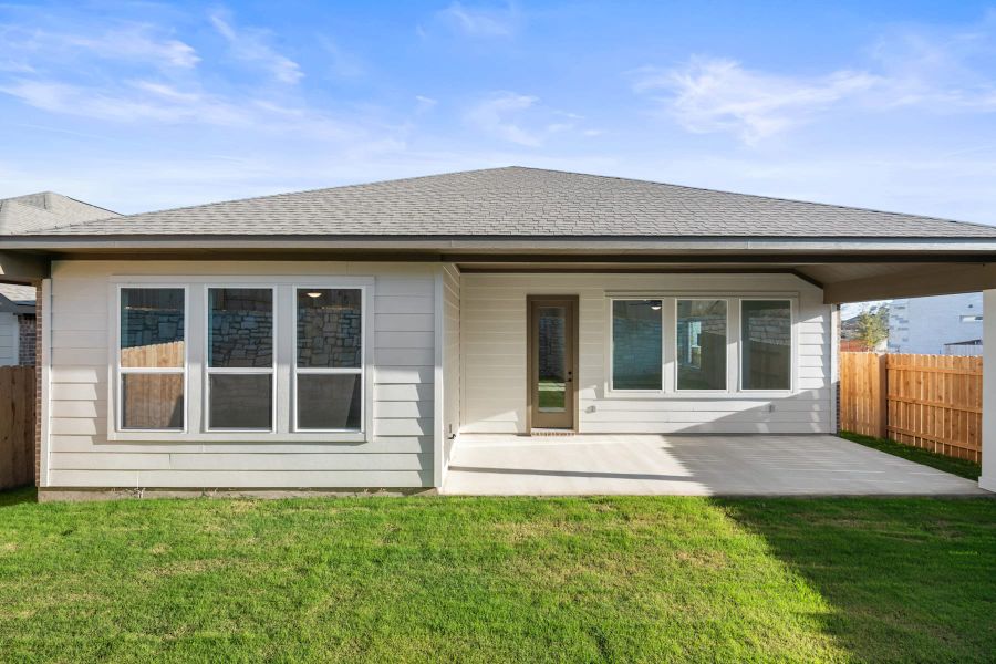 Exterior details and patio area of a home in Lariat, Liberty Hill (Image 24).