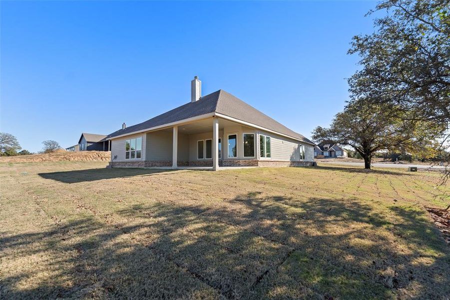 Exterior details and patio area of a home in Oak Grove Addition, Springtown (Image 27).
