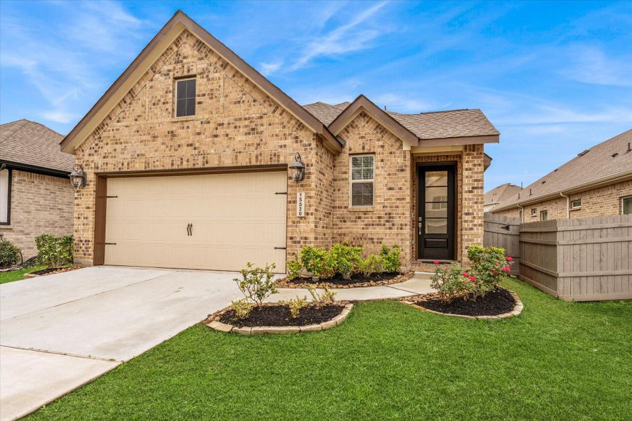 Front exterior of a new home in , Conroe, TX, highlighting curb appeal (Image 21). Front exterior of a new home in , Conroe, TX, highlighting curb appeal (Image 21).