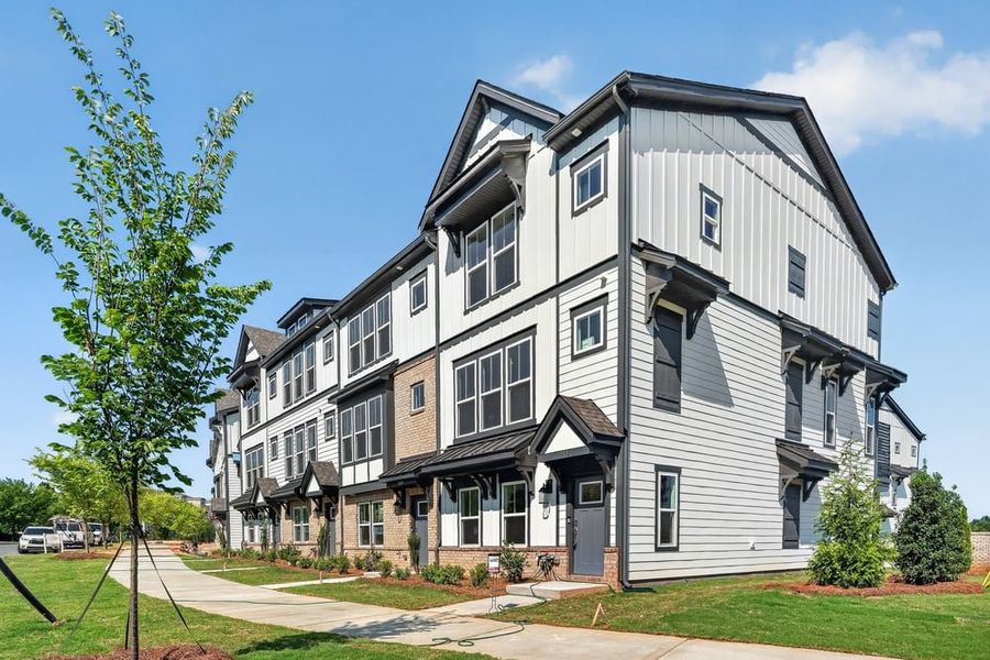 Front exterior of a new home in Senata at Research Park, Charlotte, NC, highlighting curb appeal (Image 1). Front exterior of a new home in Senata at Research Park, Charlotte, NC, highlighting curb appeal (Image 1).