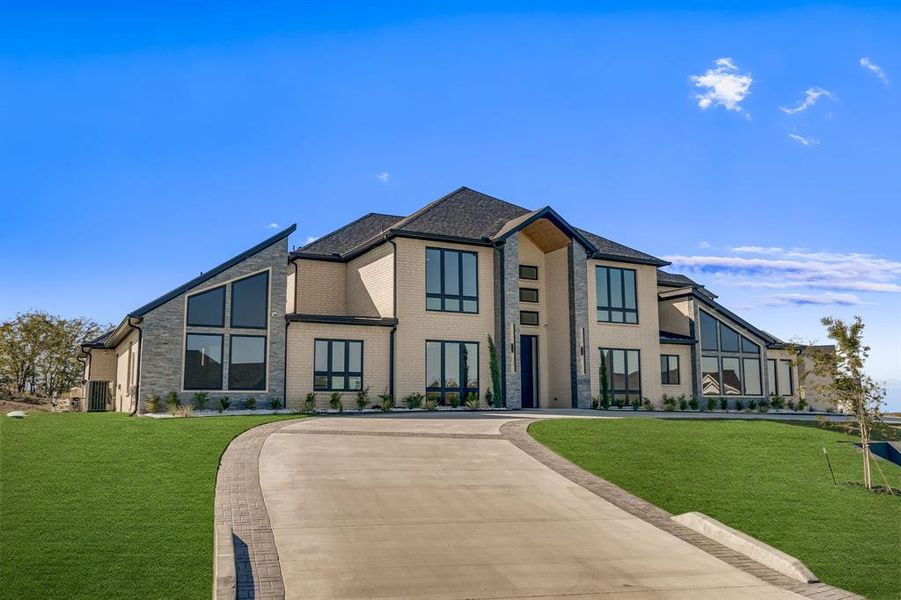Front exterior of a new home in , Gunter, TX, highlighting curb appeal (Image 1). Front exterior of a new home in , Gunter, TX, highlighting curb appeal (Image 1).