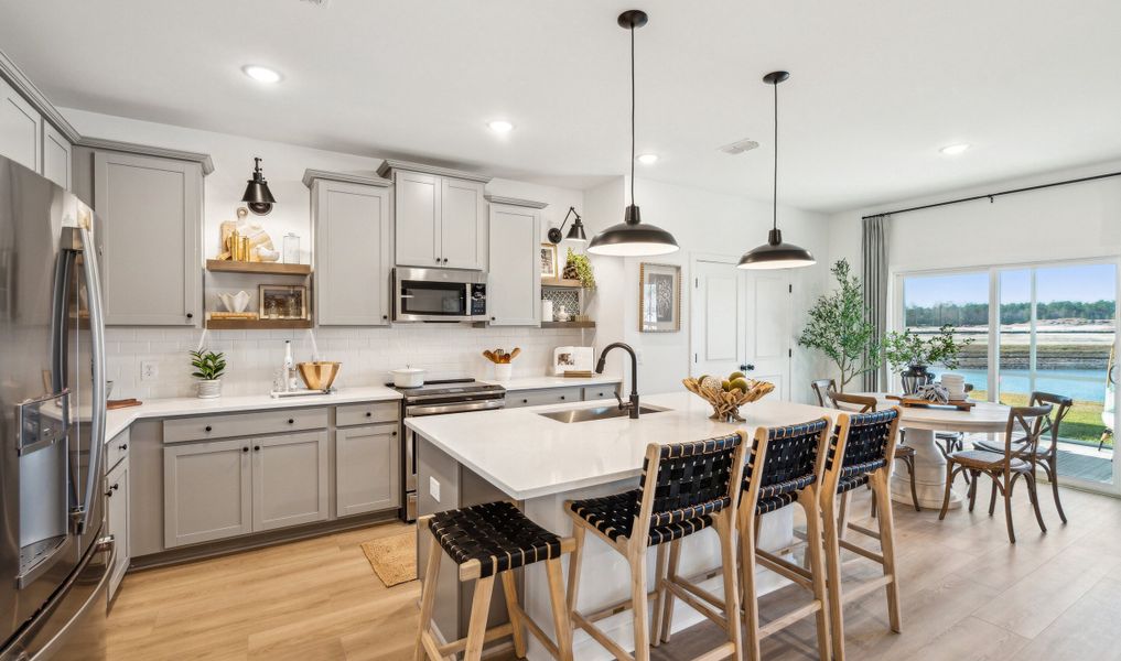 Kitchen with pendant lights over island