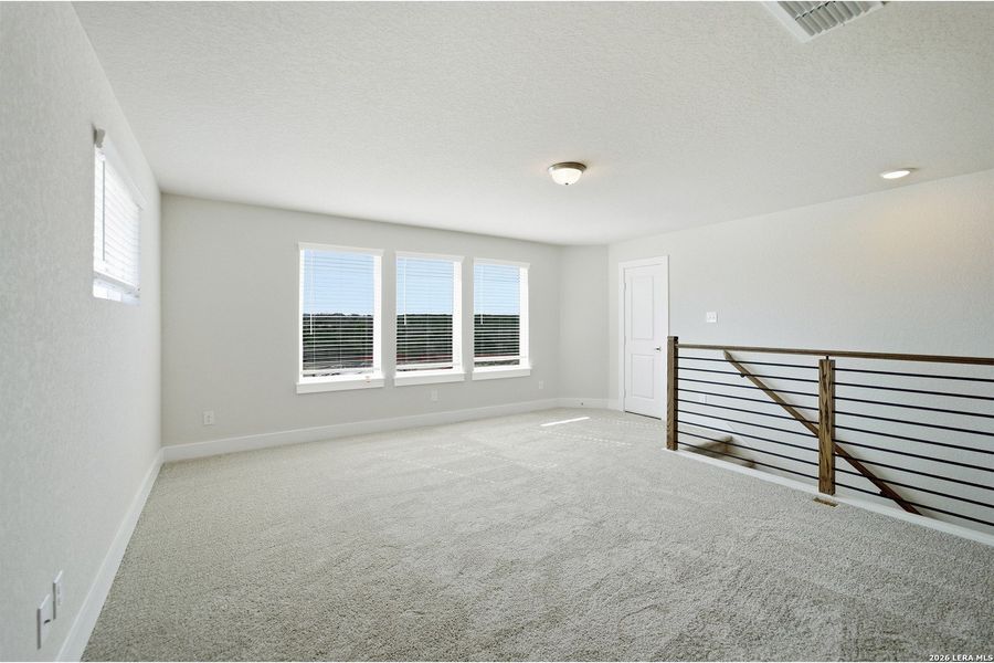 Spacious, unfurnished interior of a new home in The Woodlands at Medina Hills, Mico (Image 35).