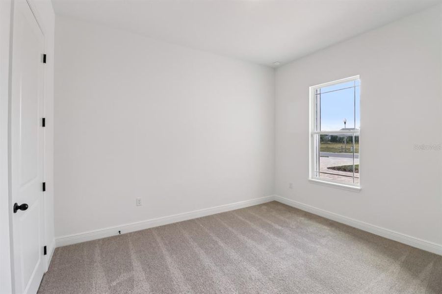 Spacious, unfurnished interior of a new home in Ardisia Park Estate, New Smyrna Beach (Image 9).