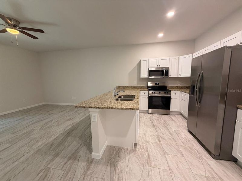 Furnished interior view inside a new home in , Port Charlotte (Image 7). Furnished interior view inside a new home in , Port Charlotte (Image 7).