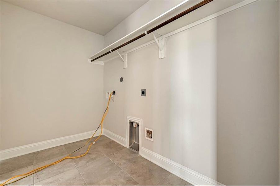 The Laundry Room off of the garage *Stock Photo- Colors and features may vary from actual home