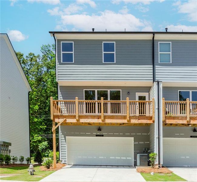 Front exterior of a new home in Hillcrest Landing, Sugar Hill, GA, highlighting curb appeal (Image 30). Front exterior of a new home in Hillcrest Landing, Sugar Hill, GA, highlighting curb appeal (Image 30).