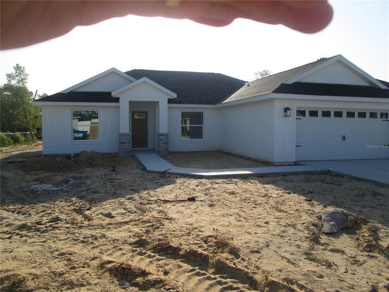 Front exterior of a new home in , Ocala, FL, highlighting curb appeal (Image 39).