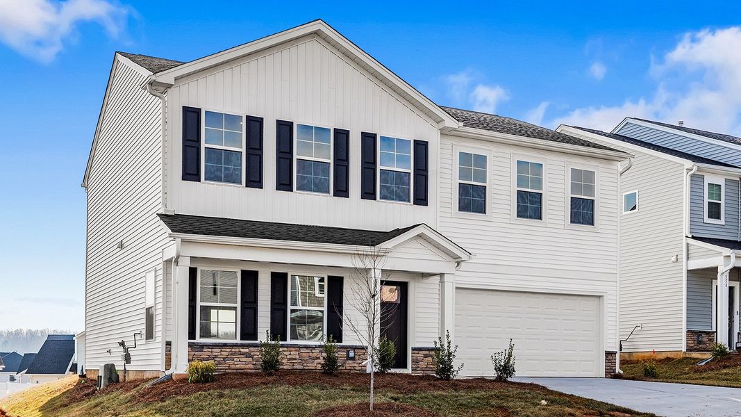 Front exterior of a new home in Hanes Lake, Winston-Salem, NC, highlighting curb appeal (Image 20). Front exterior of a new home in Hanes Lake, Winston-Salem, NC, highlighting curb appeal (Image 20).