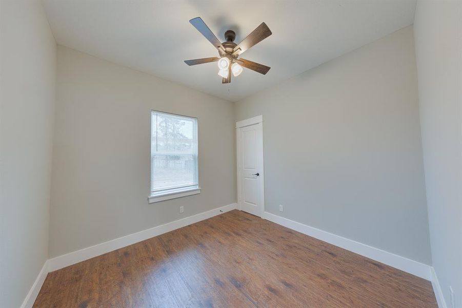 Third bedroom with a generous walk-in closet, providing plenty of storage and a cozy, functional living space.