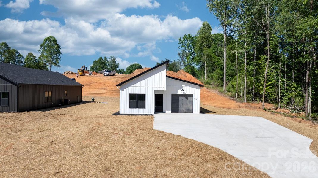 Front exterior of a new home in , Lenoir, NC, highlighting curb appeal (Image 20).