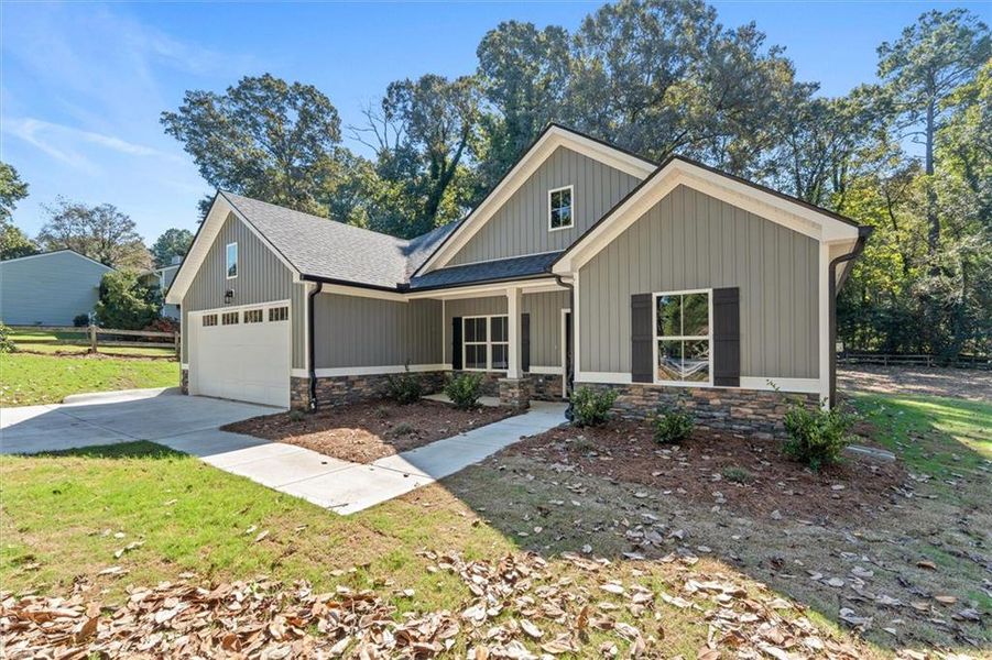 Front exterior of a new home in , Carrollton, GA, highlighting curb appeal (Image 23).