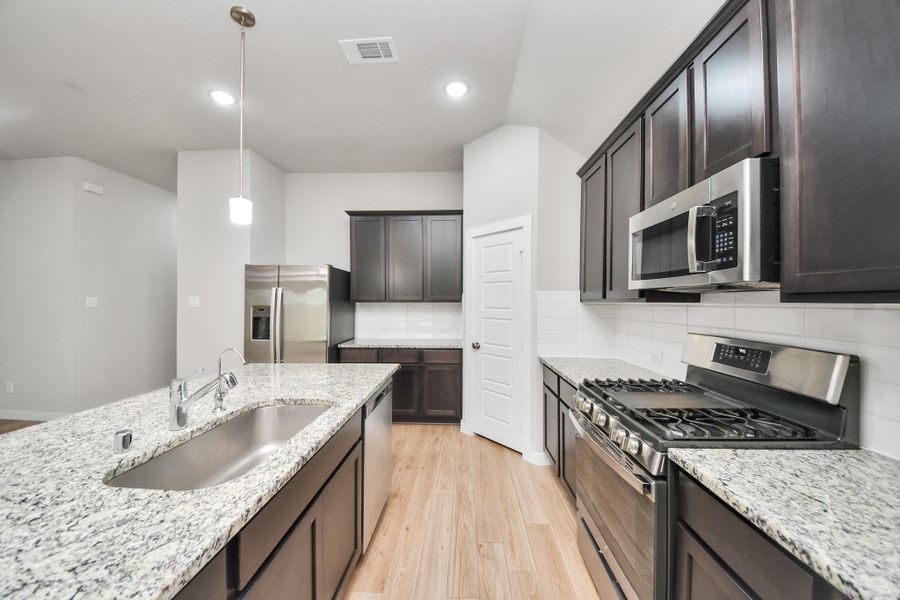 Furnished interior view inside a new home in Marvida, Cypress (Image 8).