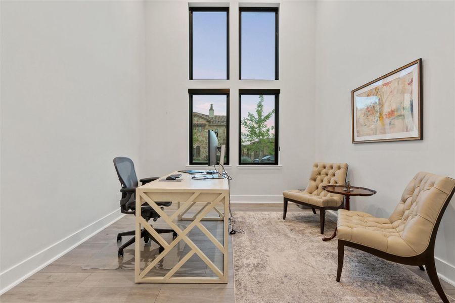 Private study with French doors and high ceiling.