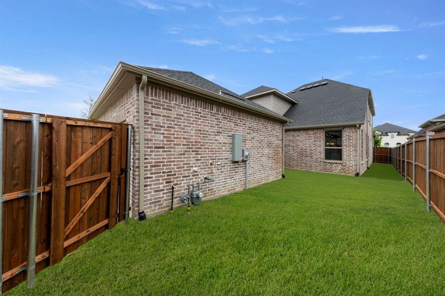 Front exterior of a new home in Cambridge Crossing, Celina, TX, highlighting curb appeal (Image 18).