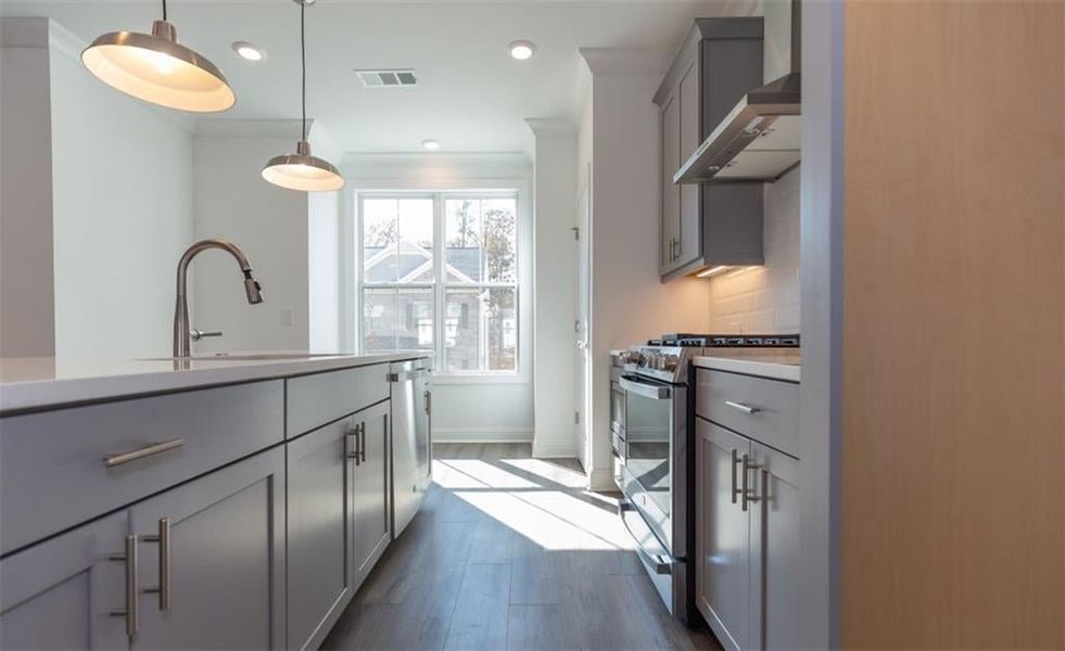 All GE stainless steel appliances in the Glendale townhome. Photo for representation purposes only, not of actual home but a  previously built TPG home.