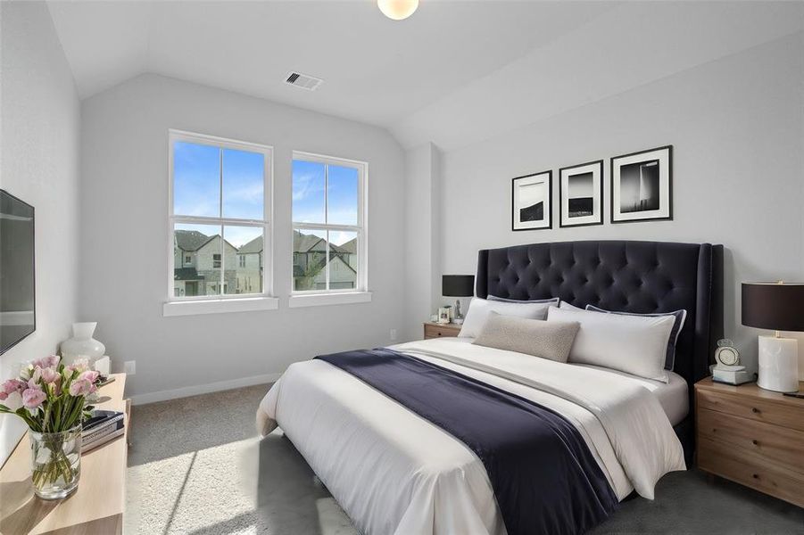 Secondary bedroom features plush carpet, custom paint, high ceilings, large window with privacy blinds, and it's own private bathroom.