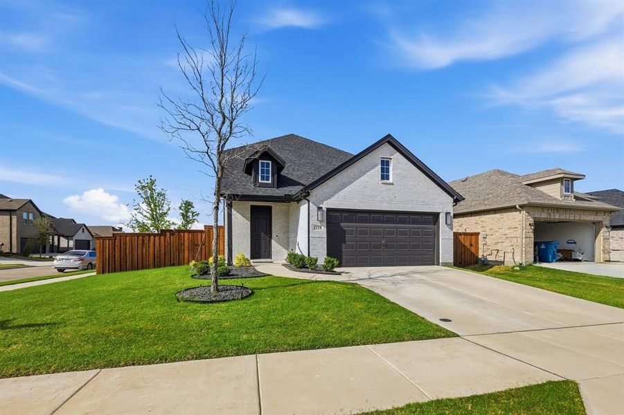 Front exterior of a new home in , Rhome, TX, highlighting curb appeal (Image 1). Front exterior of a new home in , Rhome, TX, highlighting curb appeal (Image 1).