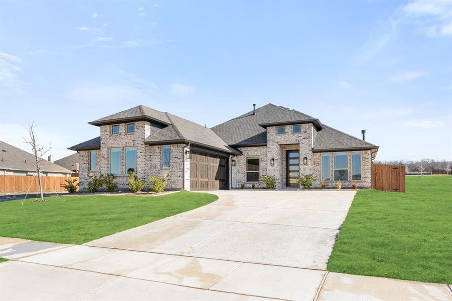 Front exterior of a new home in Parks at Panchasarp Farms, Burleson, TX, highlighting curb appeal (Image 19).