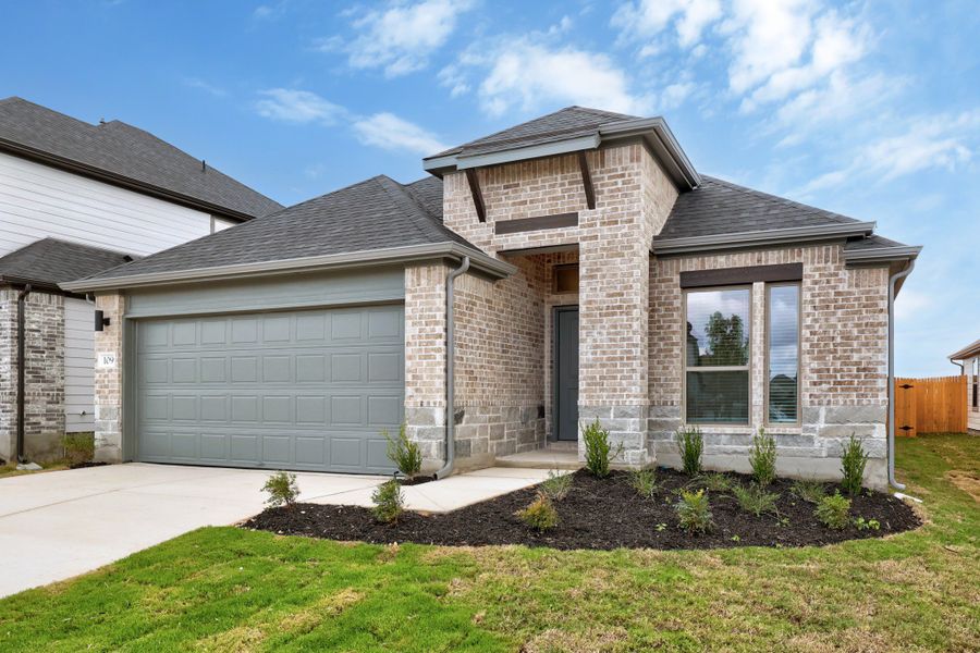 Front exterior of a new home in Prairie Winds, Hutto, TX, highlighting curb appeal (Image 19). Front exterior of a new home in Prairie Winds, Hutto, TX, highlighting curb appeal (Image 19).
