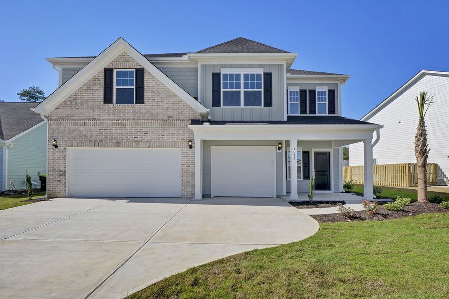 Front exterior of a new home in Grand Park, Leland, NC, highlighting curb appeal (Image 1).