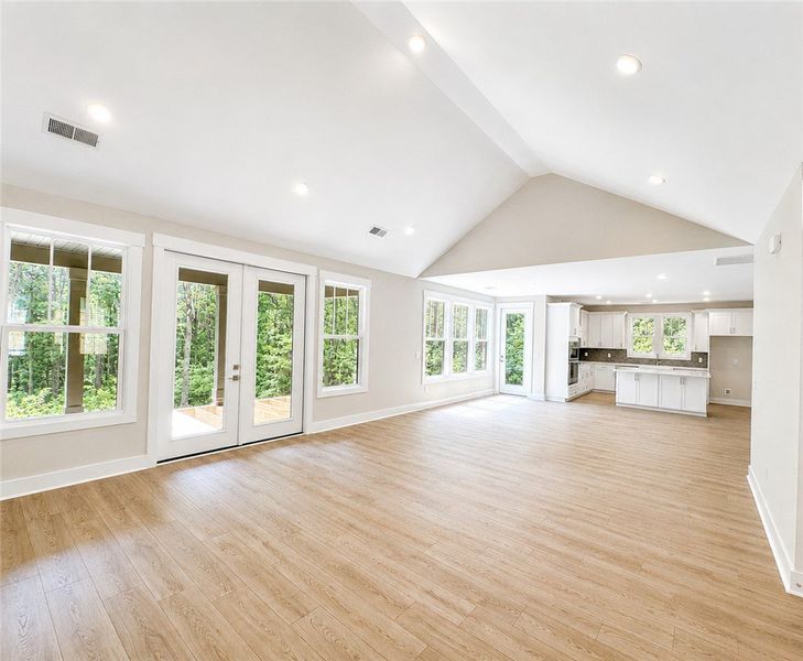 Natural light floods this inviting living space, c