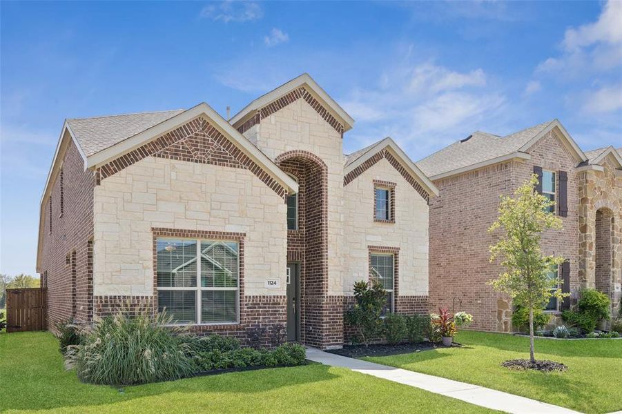 Front exterior of a new home in Wildflower Ranch: Lonestar Collection, Fort Worth, TX, highlighting curb appeal (Image 24). Front exterior of a new home in Wildflower Ranch: Lonestar Collection, Fort Worth, TX, highlighting curb appeal (Image 24).