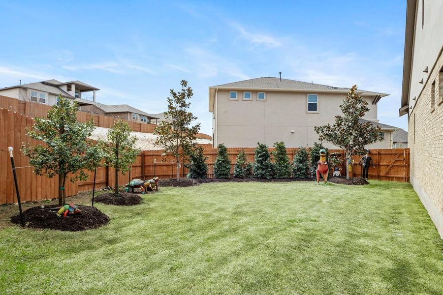 View of yard featuring a fenced backyard