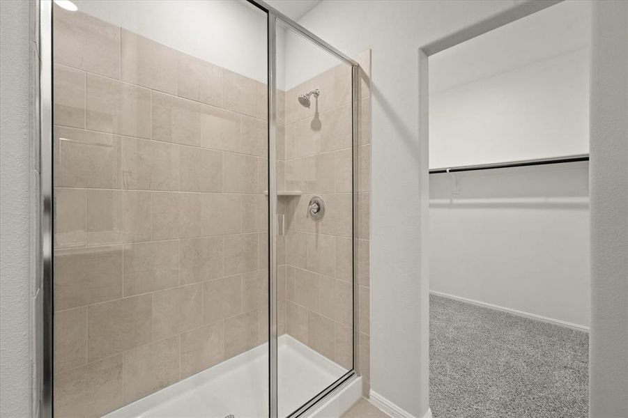 Bathroom featuring walk in shower