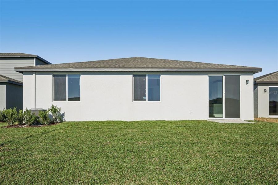Exterior details and patio area of a home in The Grove at Stuart Crossing - Classic Series, Bartow (Image 22).