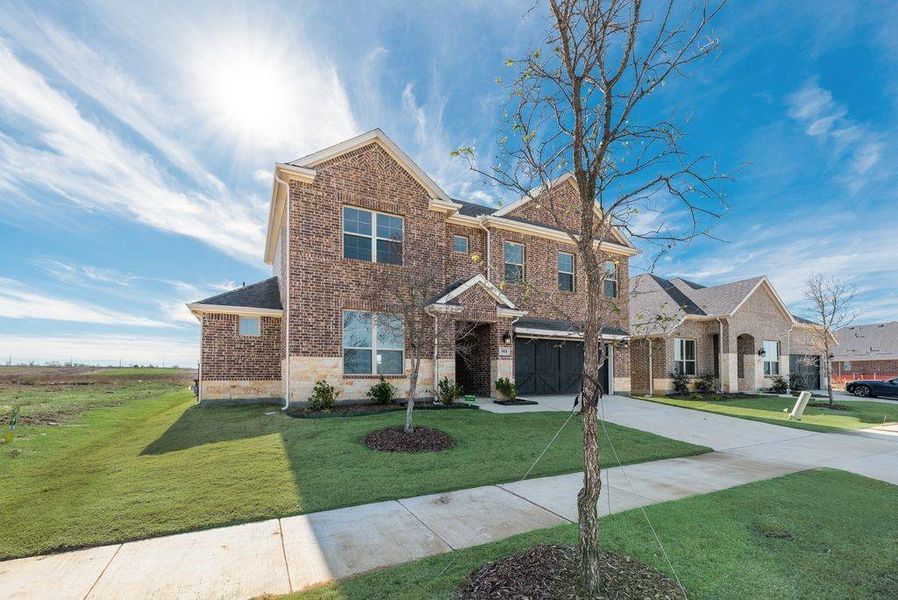 Front exterior of a new home in Arbors at Legacy Hills, Celina, TX, highlighting curb appeal (Image 19).