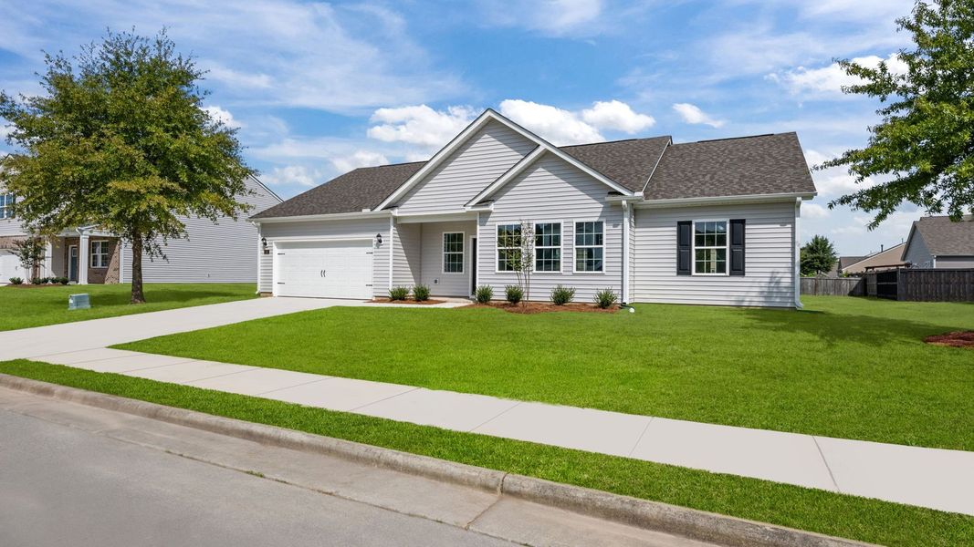 Front exterior of a new home in Tyler - Home on the Lake, New Bern, NC, highlighting curb appeal (Image 18).