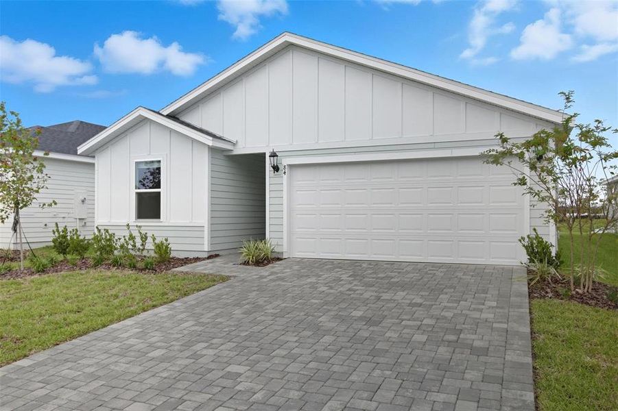 Front exterior of a new home in , Palm Coast, FL, highlighting curb appeal (Image 25). Front exterior of a new home in , Palm Coast, FL, highlighting curb appeal (Image 25).