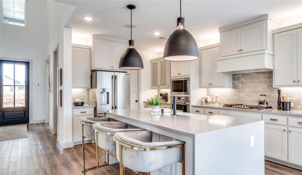 You'll love the stylish finishes, functional layout and wonderful space that this chef's kitchen offers!