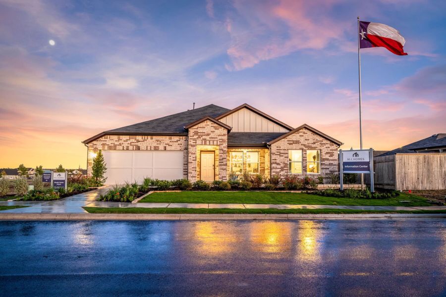 This is the front exterior of the Hawkins plan. This is the model home located in Carillon at 13305 Eppright Trace Blvd., Manor, TX This is the front exterior of the Hawkins plan. This is the model home located in Carillon at 13305 Eppright Trace Blvd., Manor, TX