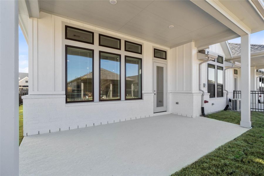 Step outside to the covered rear patio, the perfect extension of your indoor living space for year-round enjoyment. Step outside to the covered rear patio, the perfect extension of your indoor living space for year-round enjoyment.