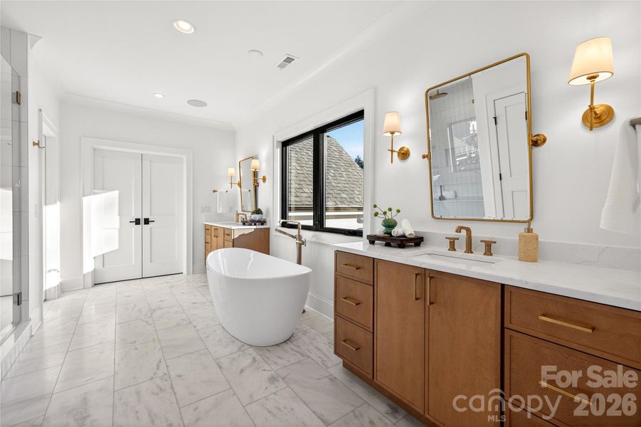Master Bathroom (Upper Level). Gorgeous freestanding tub in center of room. Large shower with rainforest shower head across from tub. 2 vanity sinks.