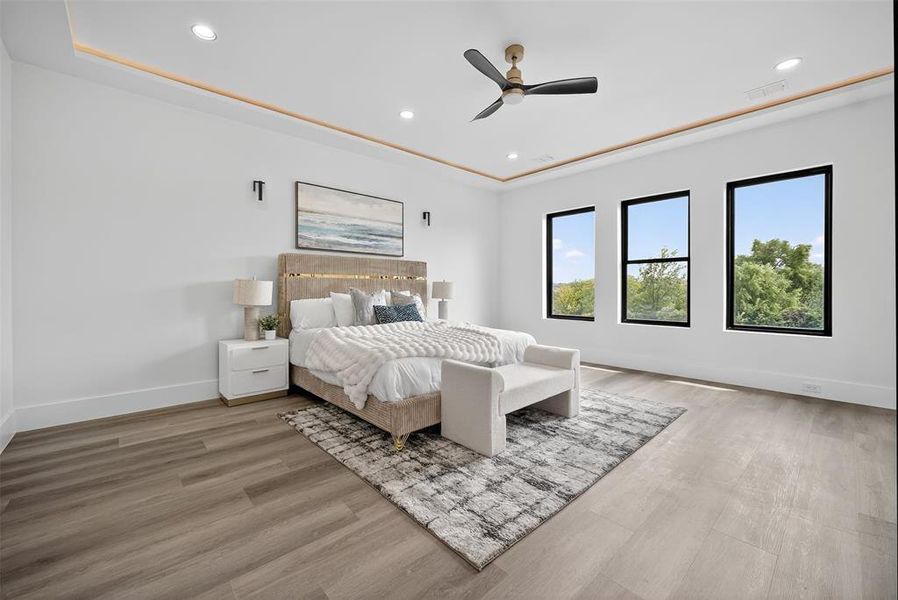 Bedroom featuring recessed lighting, light wood-style flooring, and a ceiling fan