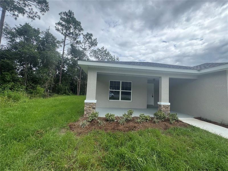 Front exterior of a new home in , Dunnellon, FL, highlighting curb appeal (Image 19).
