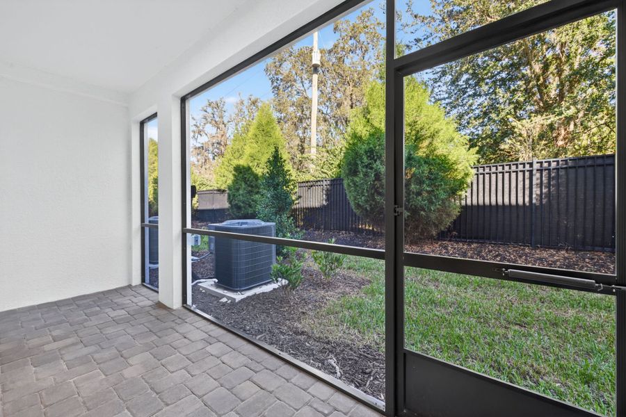 Exterior details and patio area of a home in Bloomingdale Townes, Brandon (Image 1).