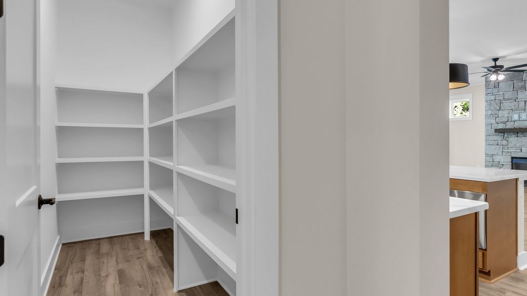 Walk-in pantry with built-in shelving