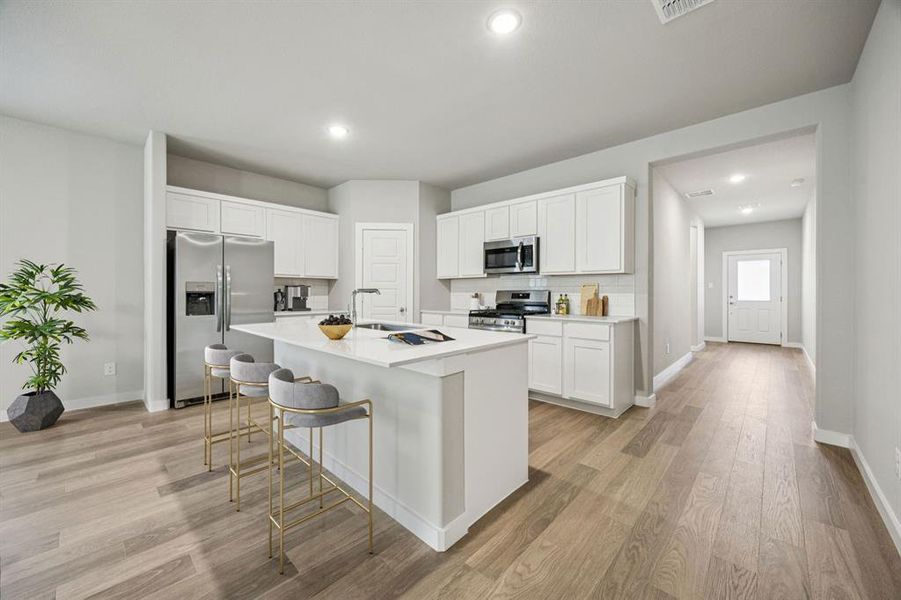 Kitchen in the Holden home plan by Trophy Signature Homes – REPRESENTATIVE PHOTO