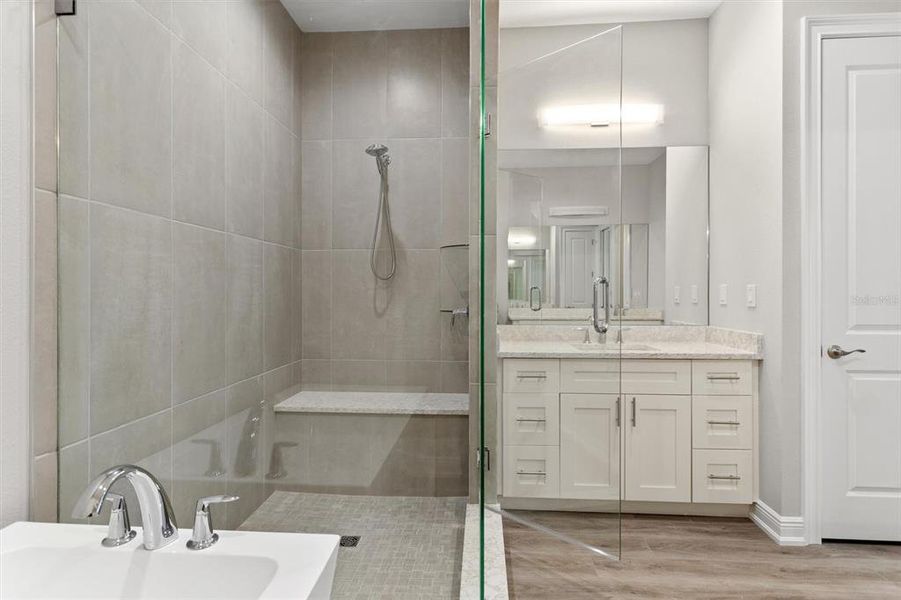 Main Bathroom close up of shower with built in bench.