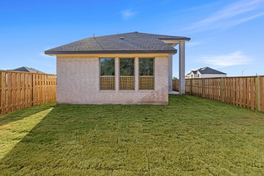 Exterior details and patio area of a home in Parmer Ranch, Georgetown (Image 25).